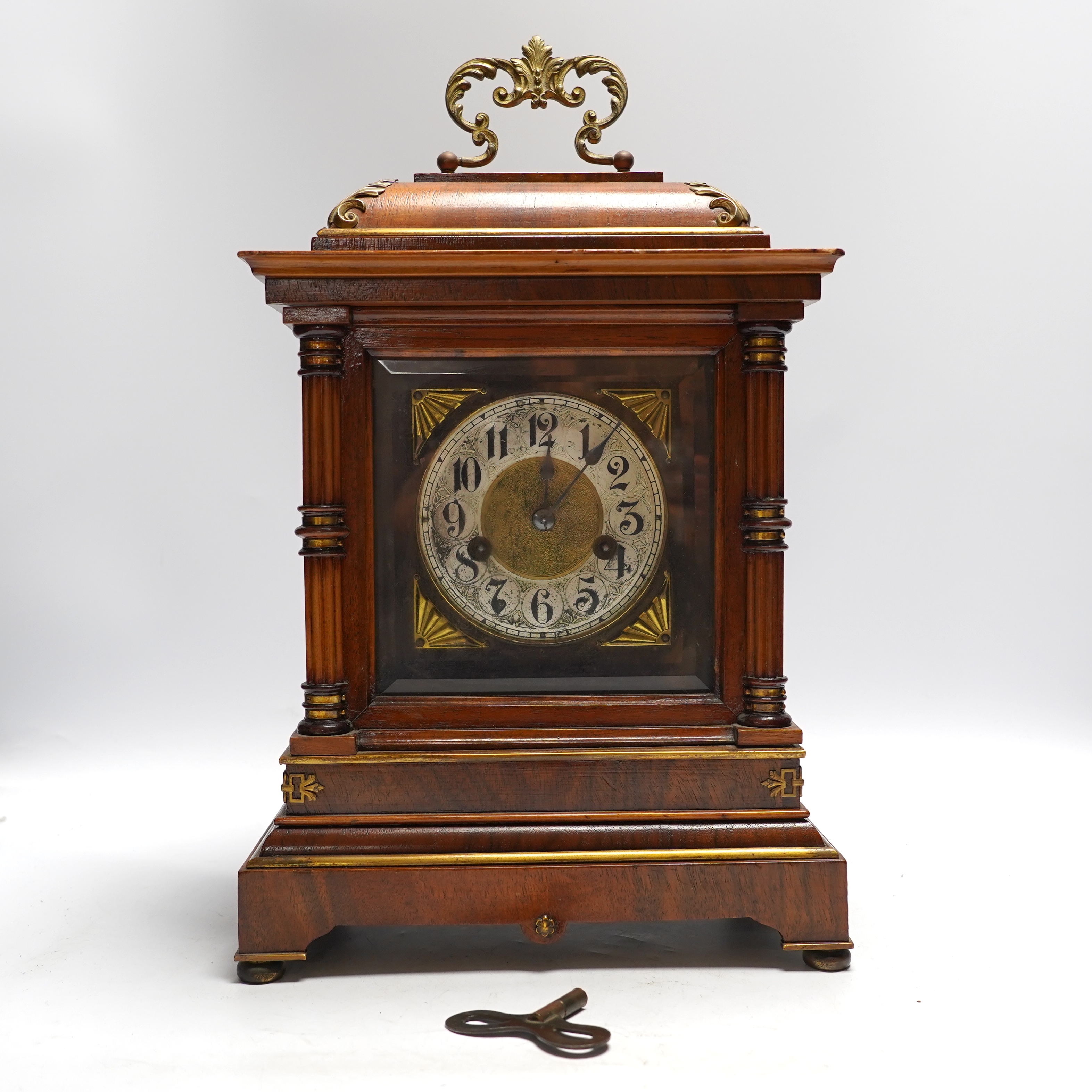 A Black Forest mantel clock with an HAC, Wurttemberg movement, striking on a coiled gong, 35cm high together with an early 20th century inlaid mahogany mantel clock